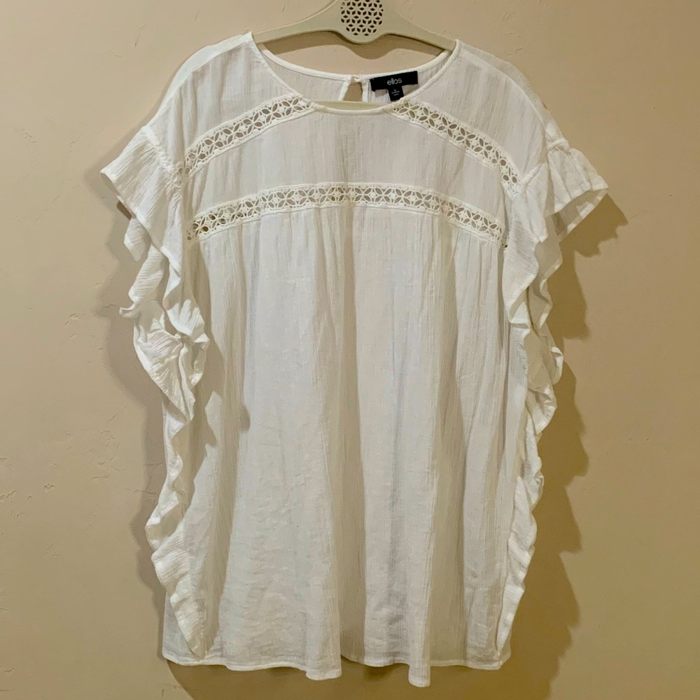 White ruffle blouse.